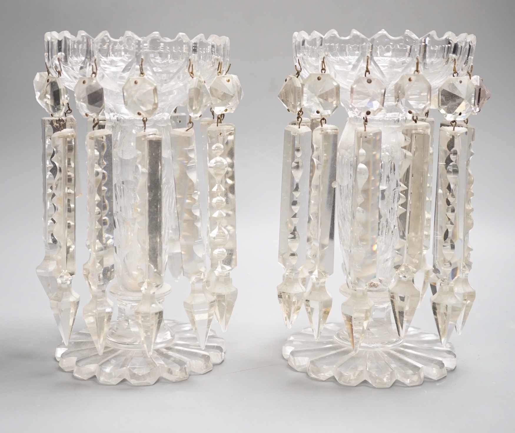 A pair of Victorian cut glass candle holders with 'spear' lustre drops (faults), 23cm high